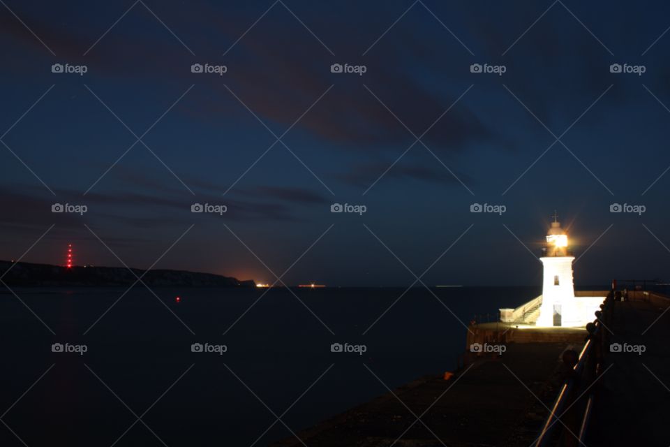photography night sea lighthouse by leonbritton123