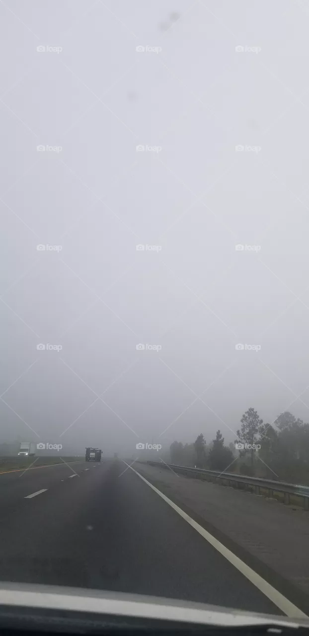 on the road foggy morning
