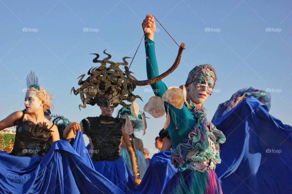 just a photo of a carnival with actors in masks