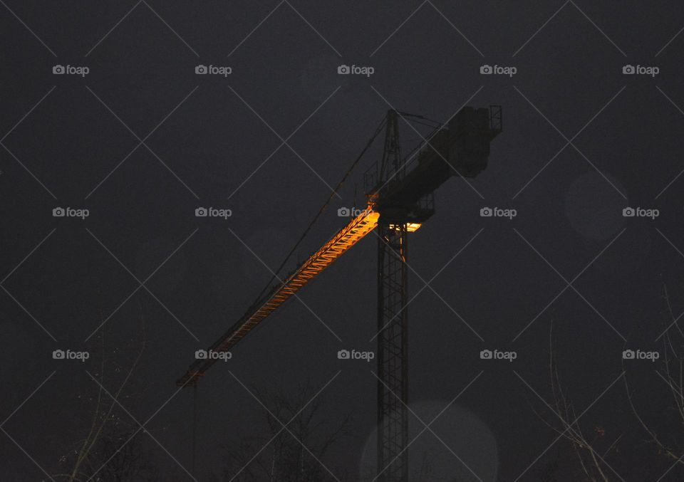 crane building lighting in the night