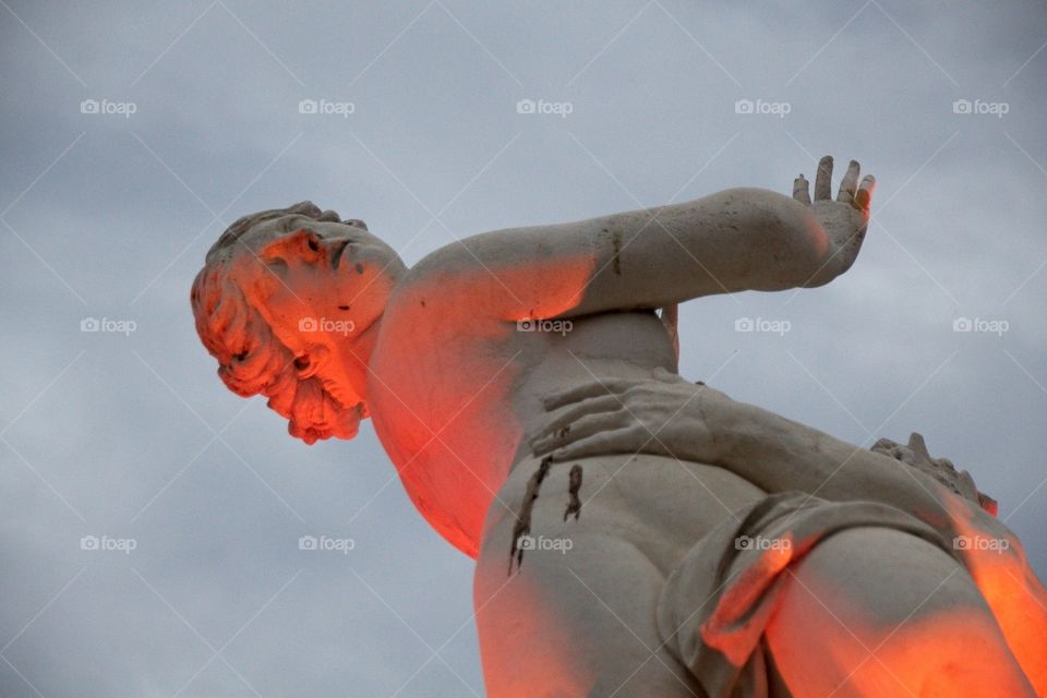 statue of a person with a sword