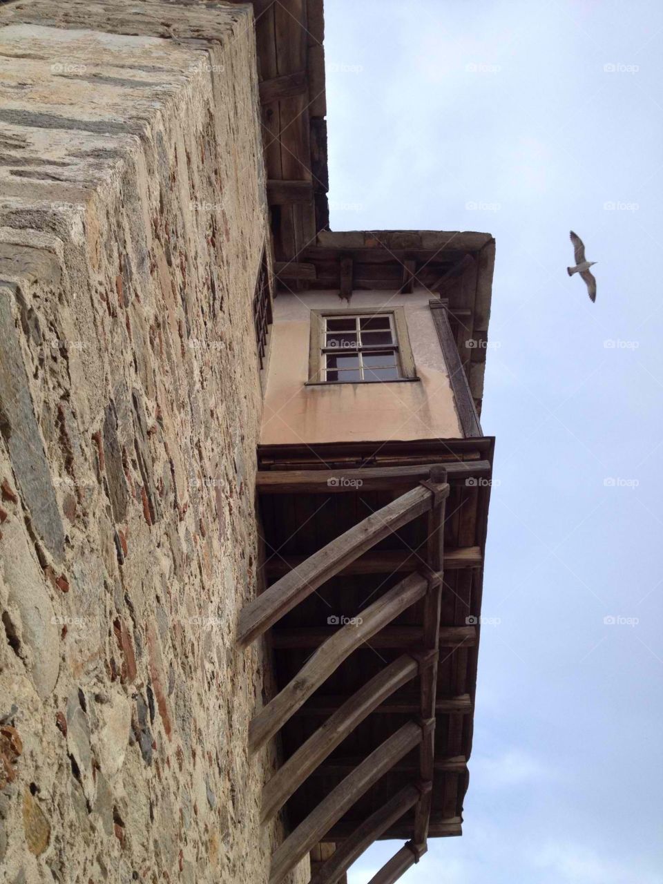 Monasteriac window. Athonic style building at ouranoupoli Halkidiki in Greece.