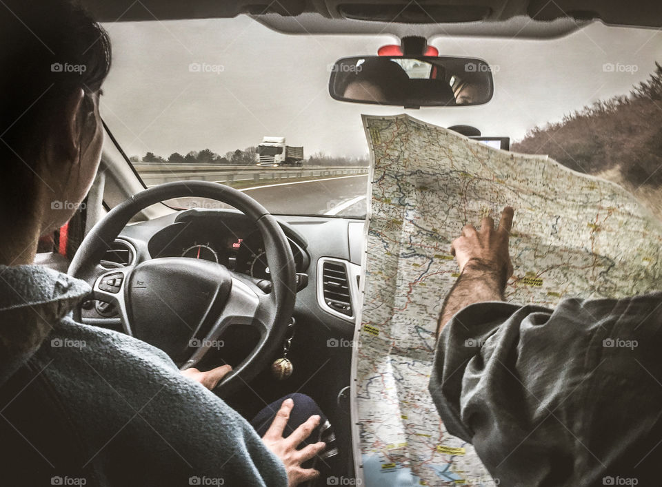 Driving A Car And Using A Road Map