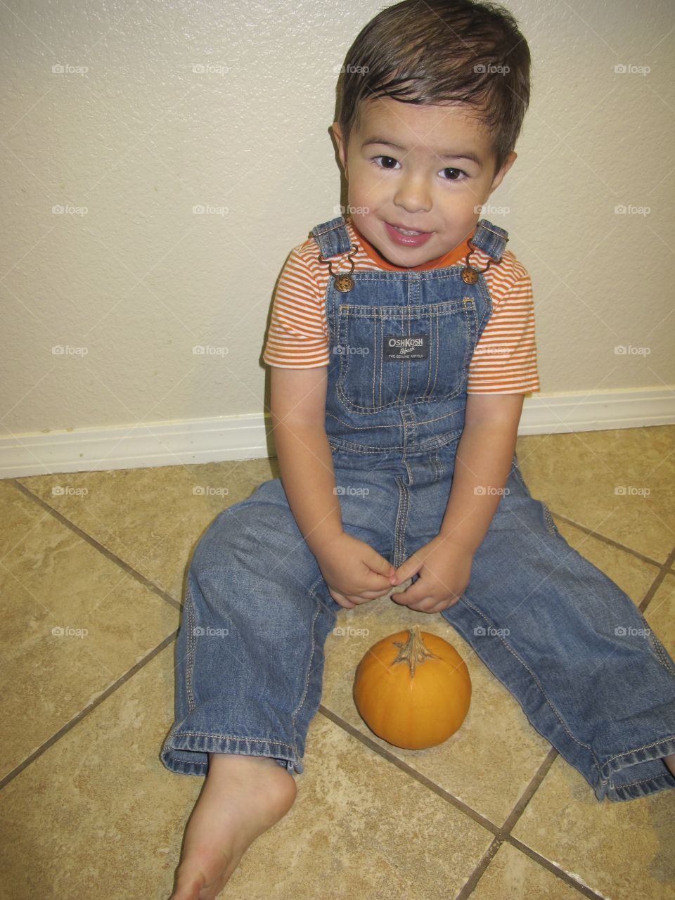 pumpkin baby. son before Halloween wroth his pumpkin