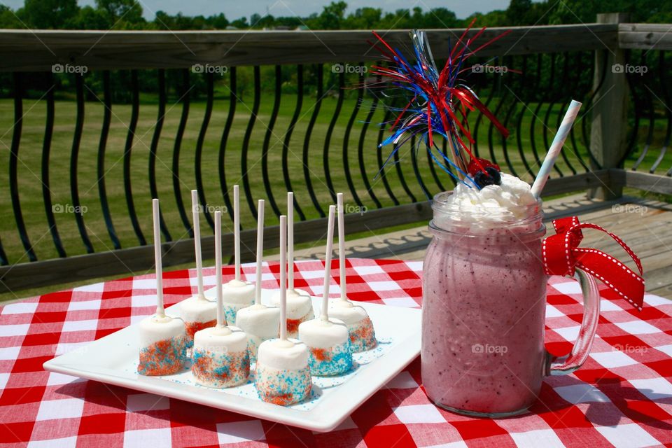 Red, White and Blue Smoothie . Marshmallows dipped in white chocolate with a strawberry and blueberry smoothie. 