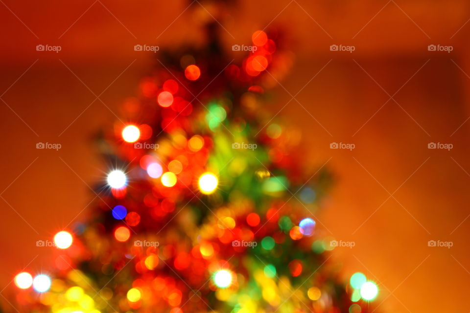 Macro shot of Christmas tree decorations and vivid lights