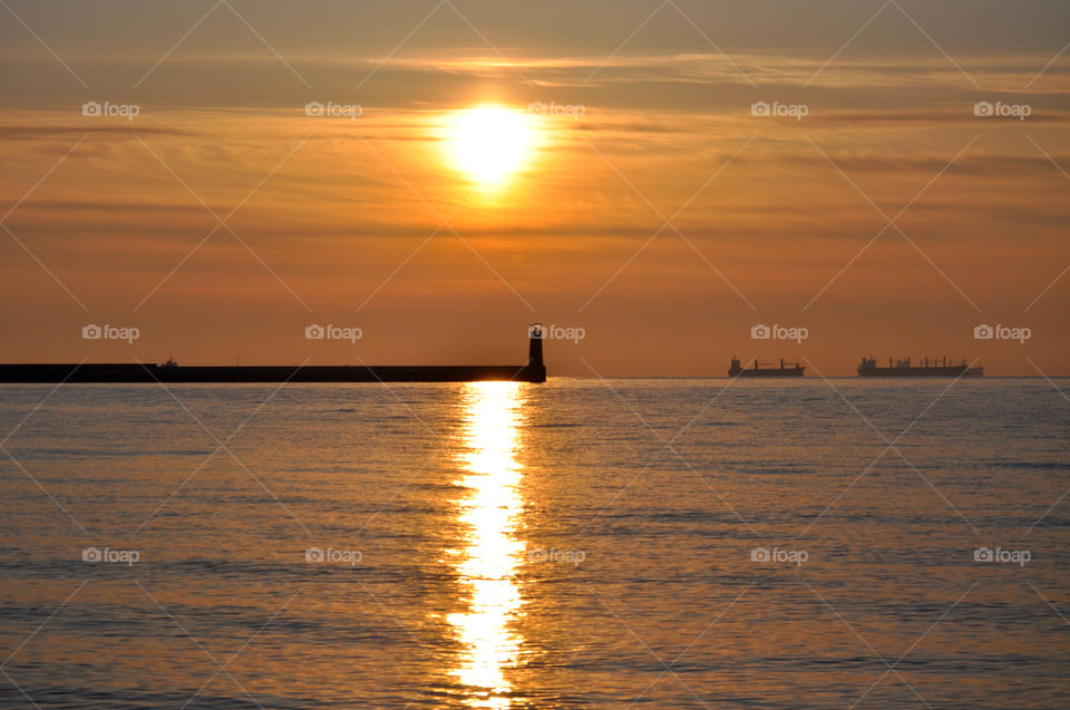 Sunrise and lighthouse 