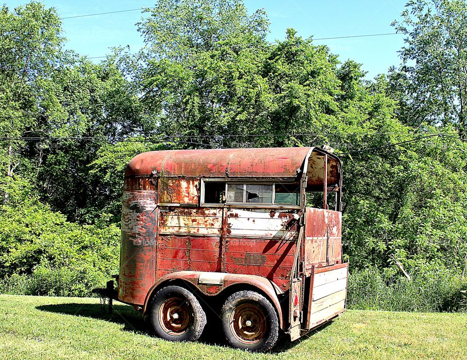 abandoned rusted horse trailer