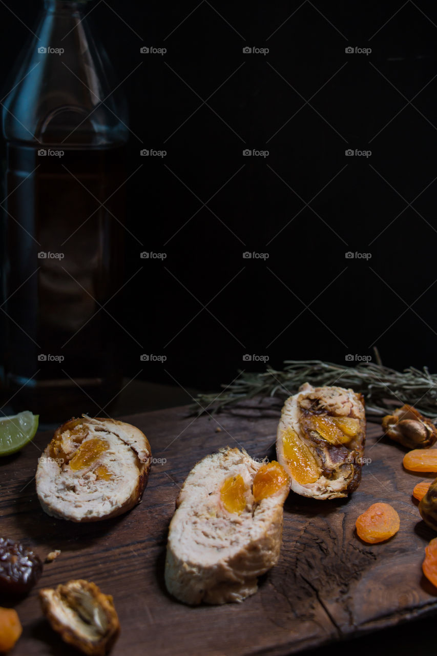 Chicken Ballotine stuffed with dates and dried apricots.