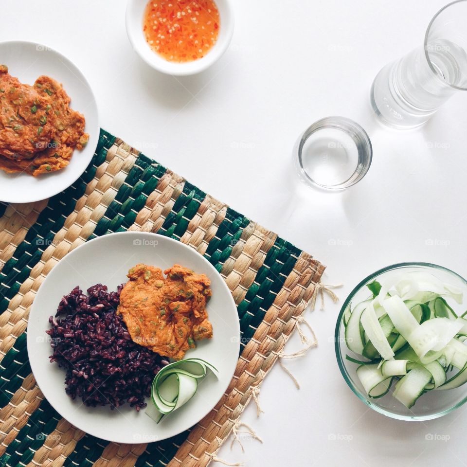 Sweet chili sauce and rice berry with cucumber slices for lunch.