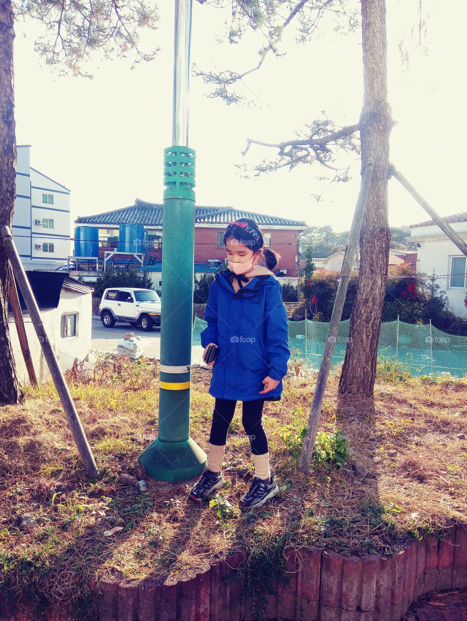 its noon time, loves the weather so much. so me and my girl went outside to have some fresh air . she loves touching everything. she moved her toes to search for stones.