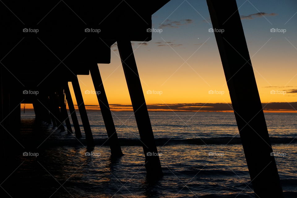 Under the Glenelg Jetty at sunset