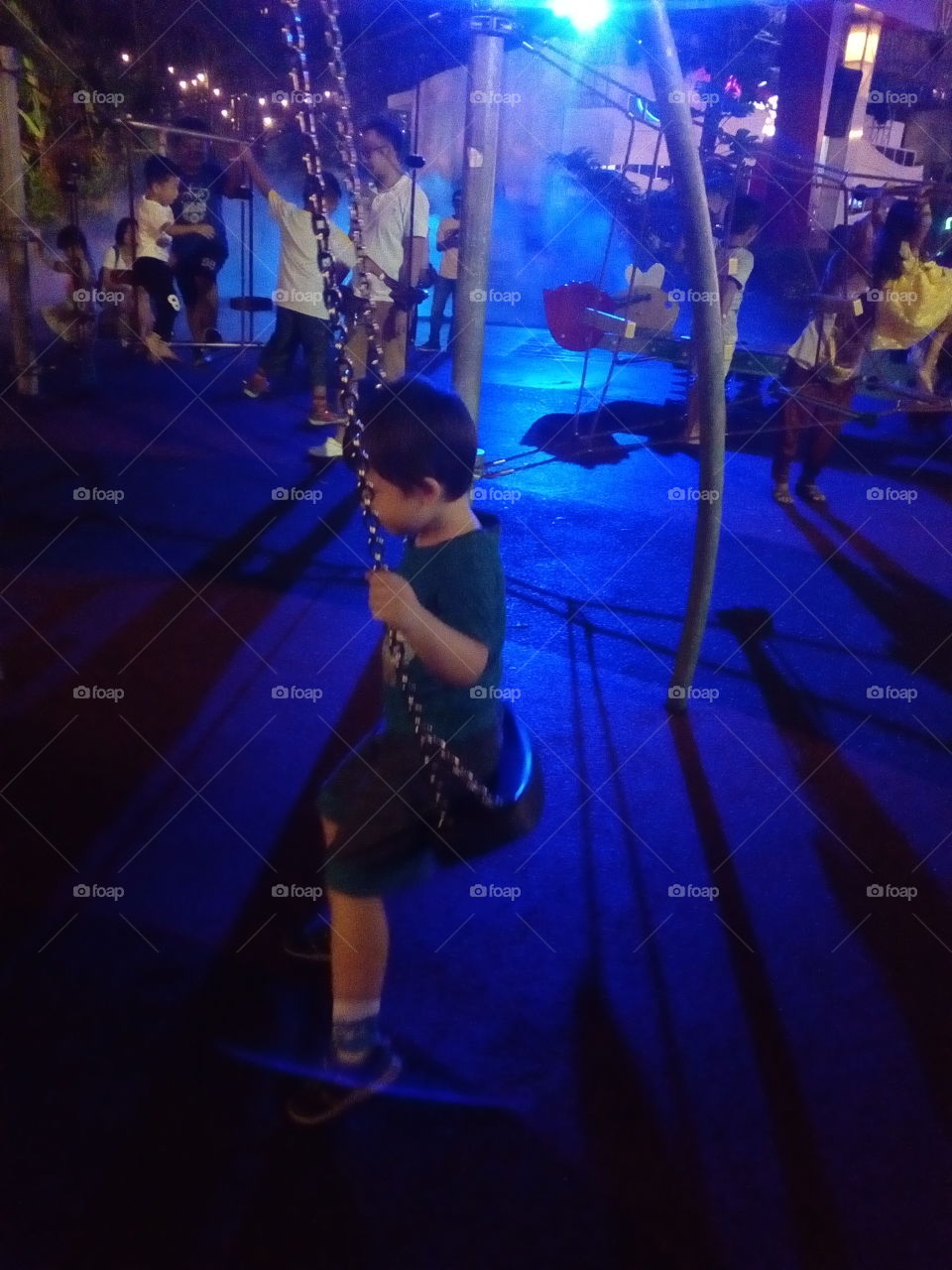 People at the playground at night