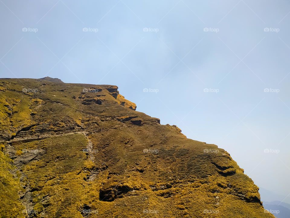A amazing view of rock in the mountains with blue sky