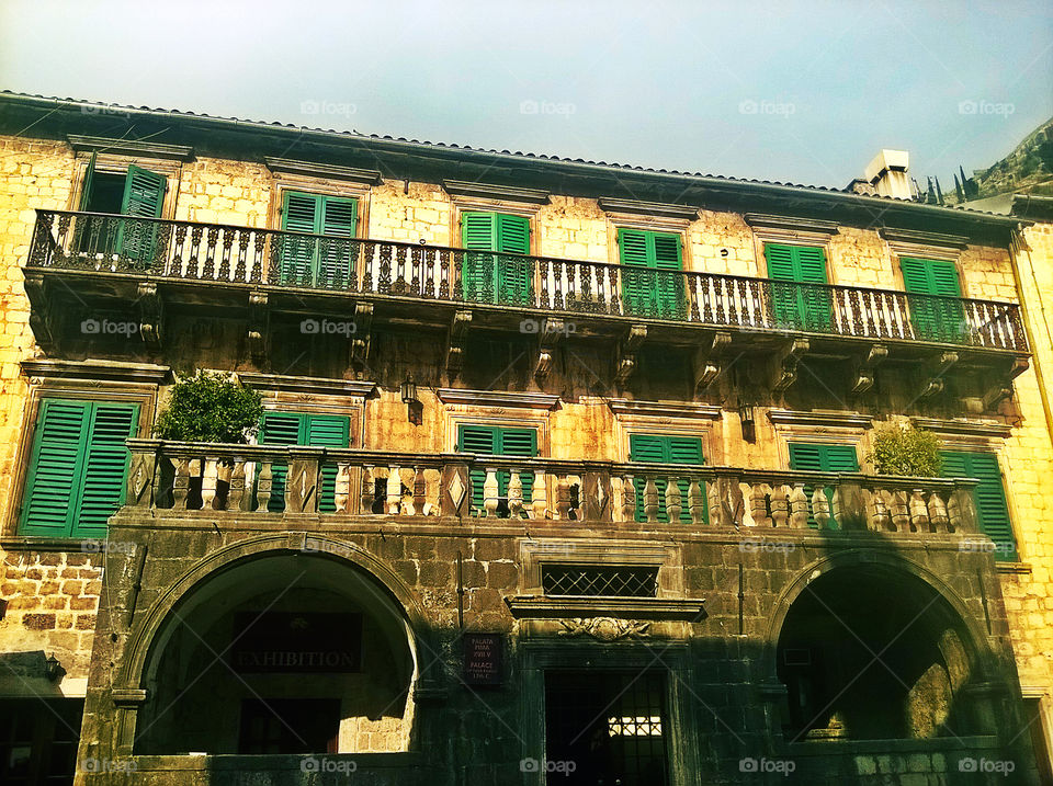 amazing historic building whit green windows