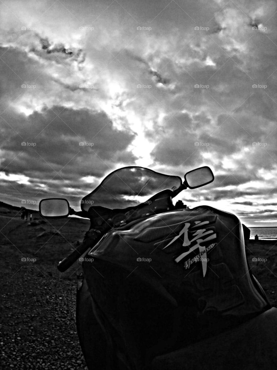 Motorcycle on beach at dusk