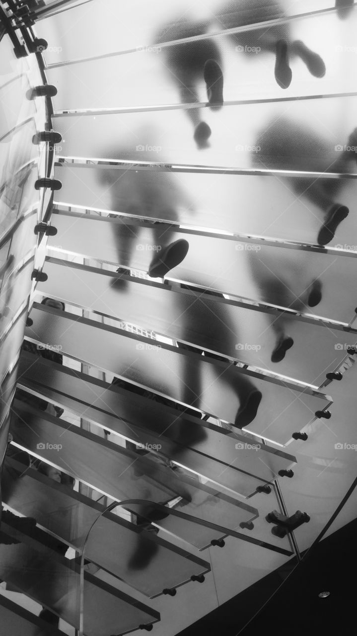 Low angle view of people on staircase