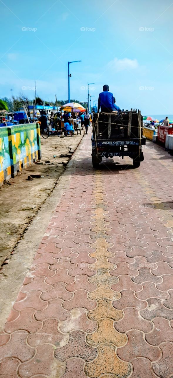 A touch of Rural Bengal. Three wheeler motorised rickshaw used to carry passengers as well as goods from one place to another. One of the cheapest mode of transport.