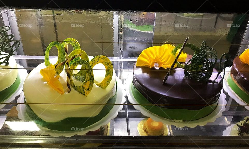 Exhibition of pies in a showcase of confectionery 