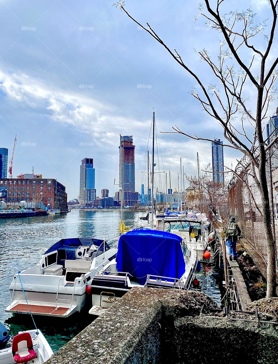Newtown Creek with its great variety of boats in the waters of the East River in Long Island City, Queens, NY on an overcast afternoon in December 2021. Hypnotic Productions