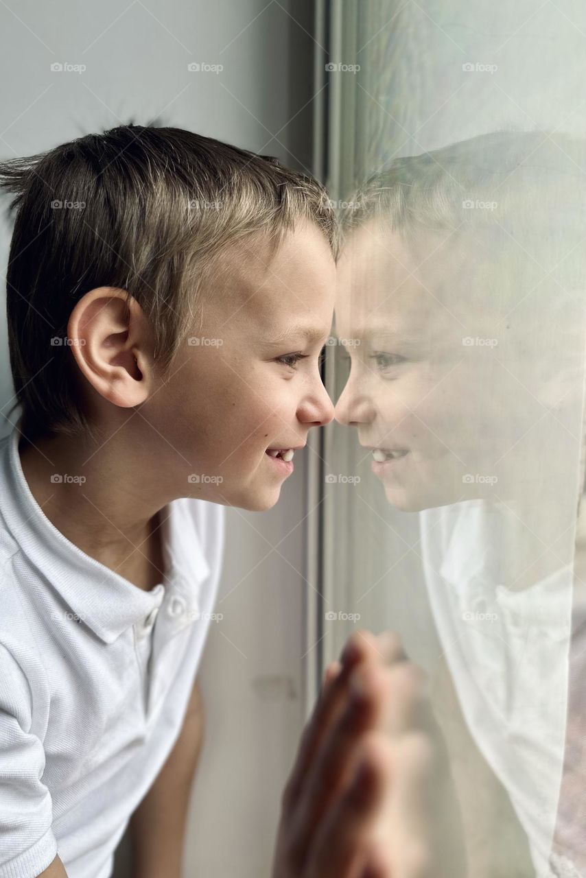 boy looking out the window