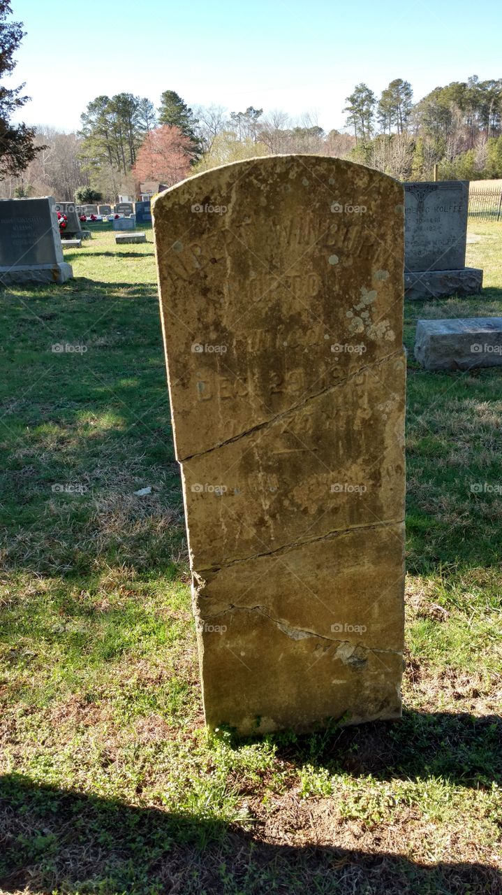 broken and repaired grave stone