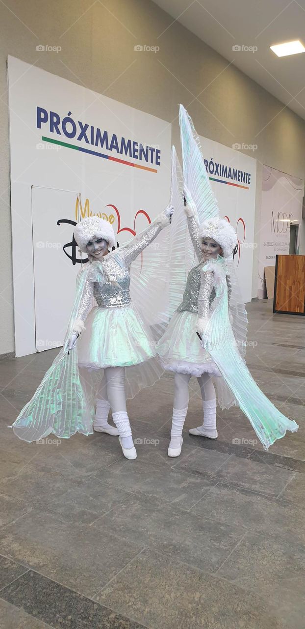 girls dressed as frozen, in white