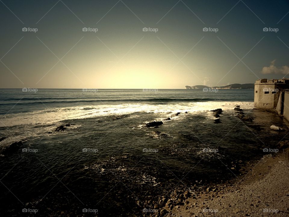 scenic view of mediterranean sea in North sardinia. with Alghero ancient fortification and view of Capocaccia