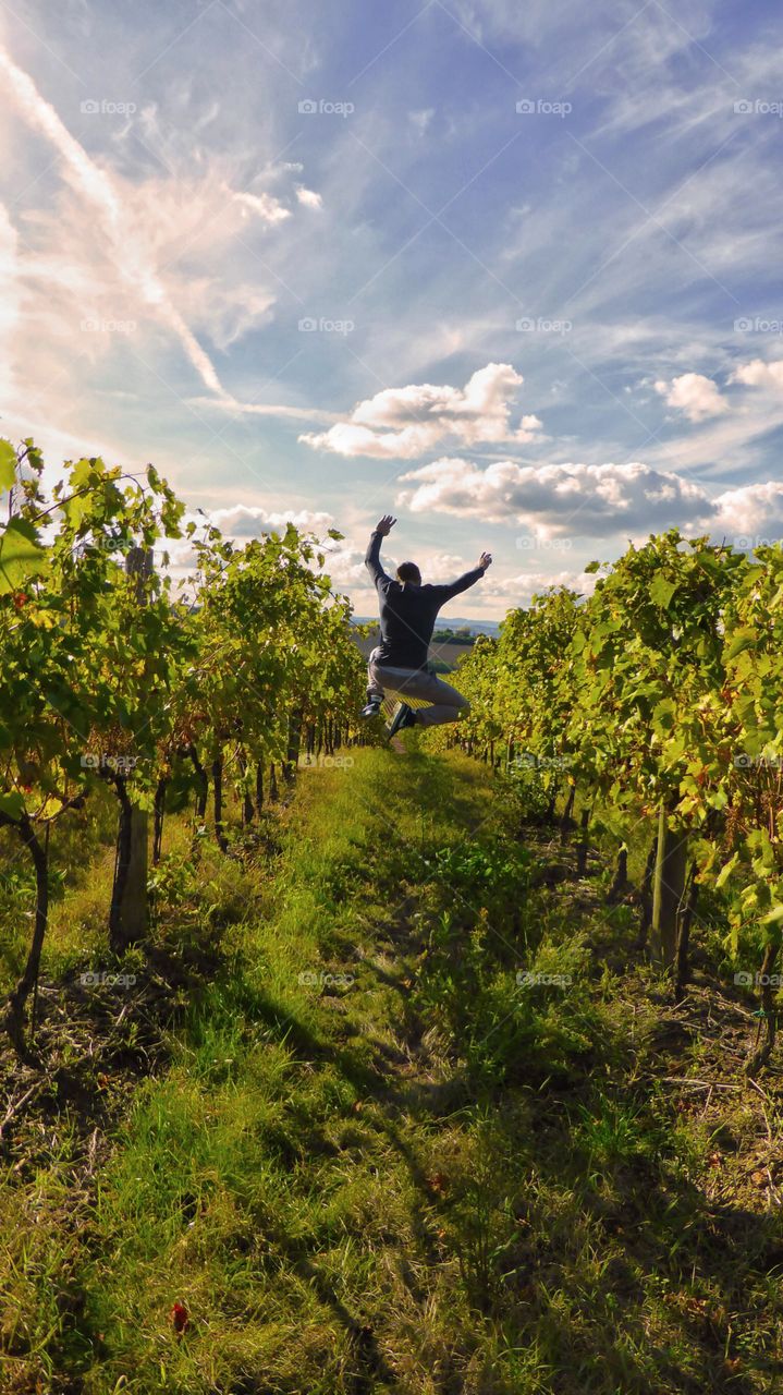 Men jumping in field