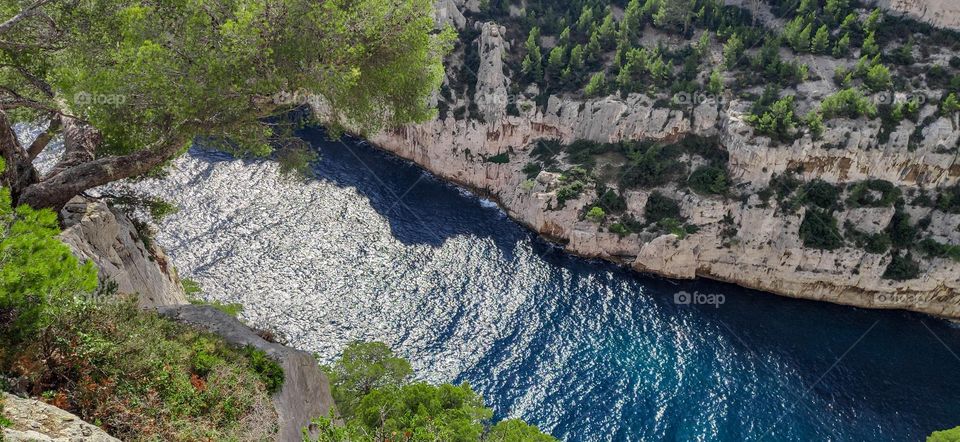 Beautiful view of the bay of the mediterranean sea among the rocks in Marseille in France, top down view close-up.