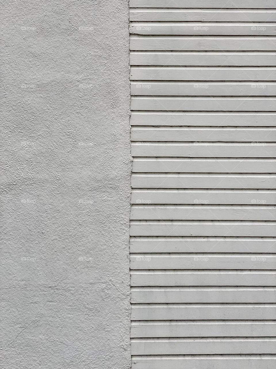 White stucco and siding on an old farmhouse