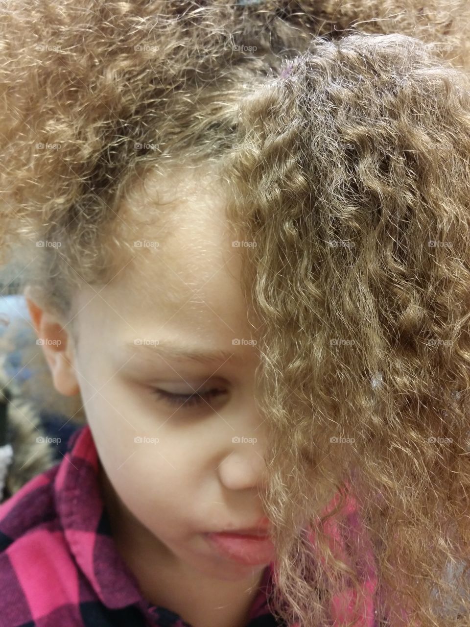 sad girl with curly hair