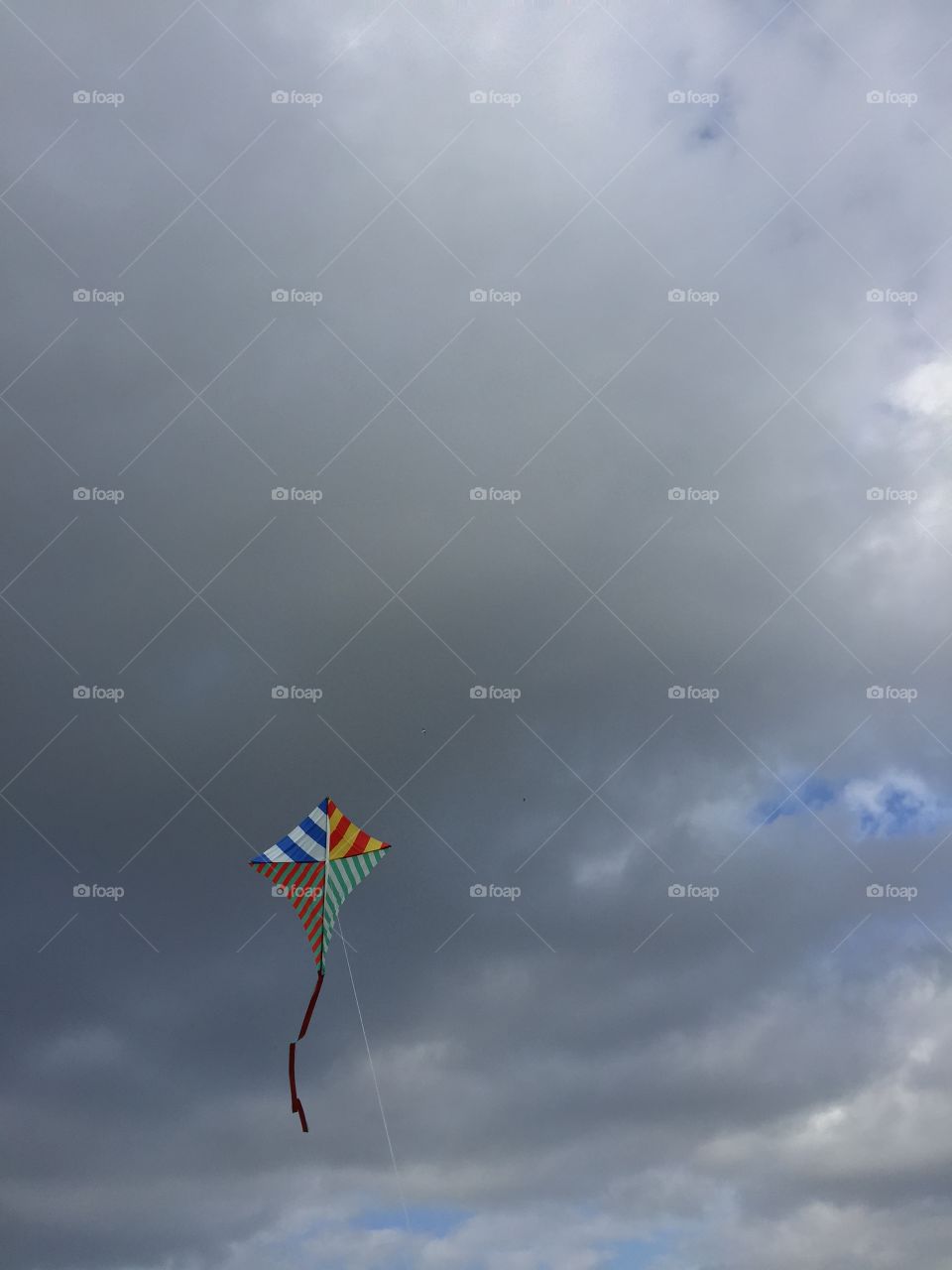 Kite in front of clouds