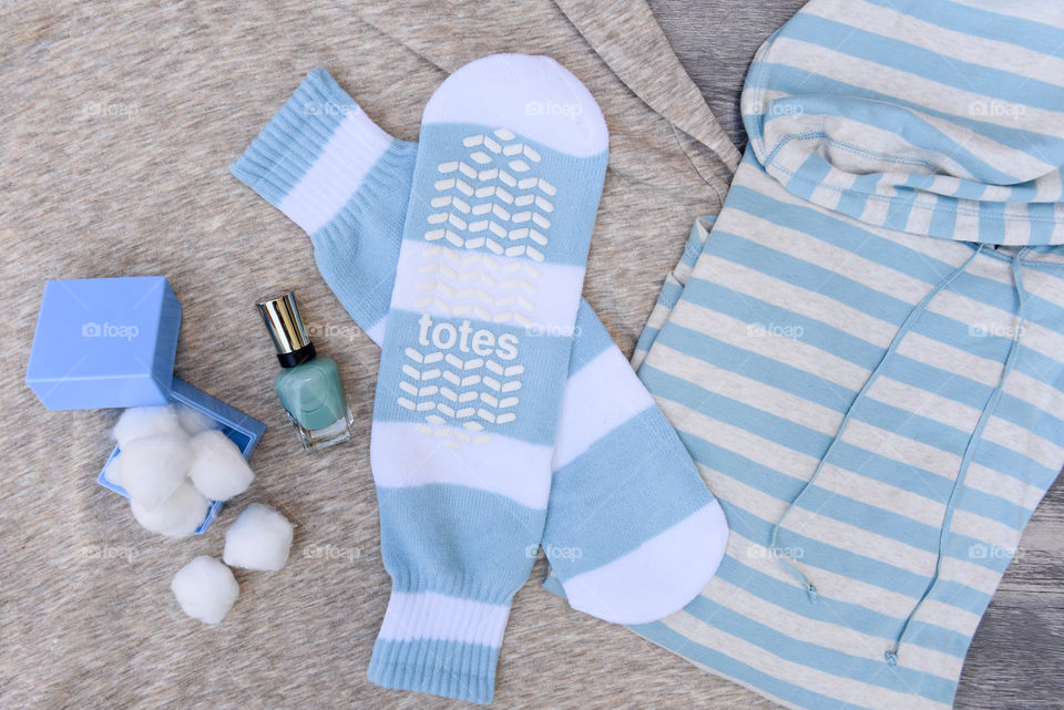 Flat lay of blue striped slipper socks and other blue items