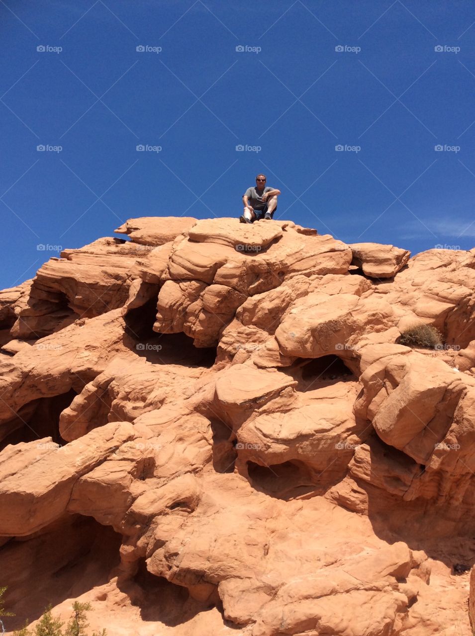 Lake Meade. My husband on top of a rock/mountain in Lake Mead.
