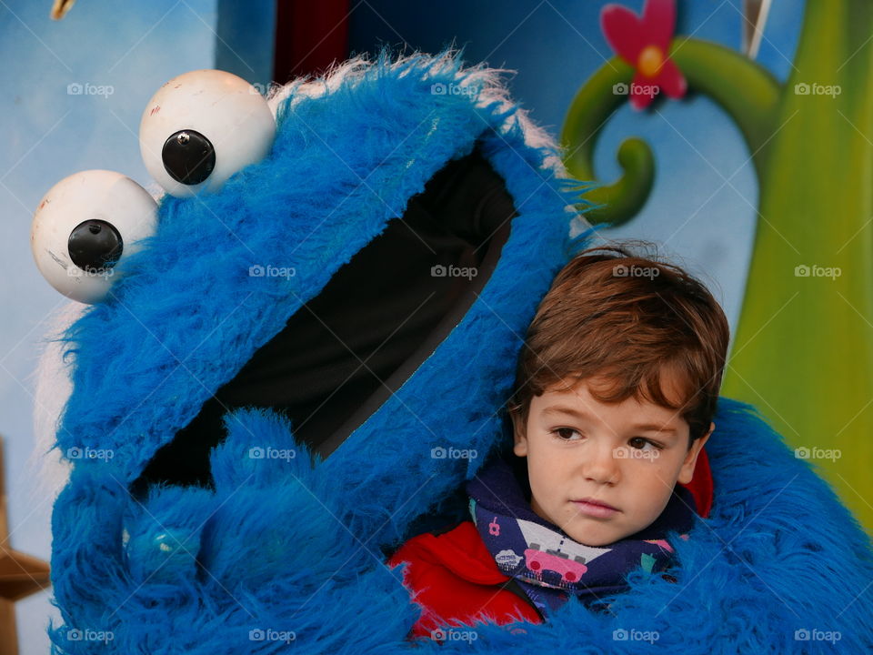 Close-up of a cute boy with muppet