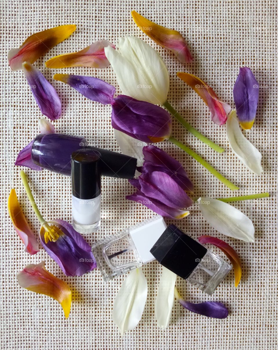 nail lacquers and tulips petals