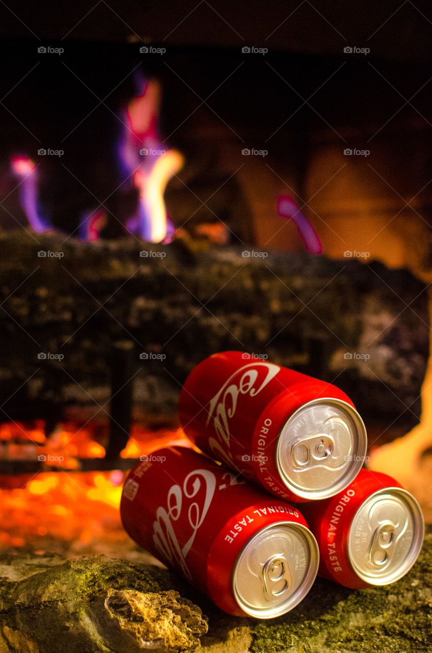 Enjoy a nice Coca-Cola in front of a warm fire