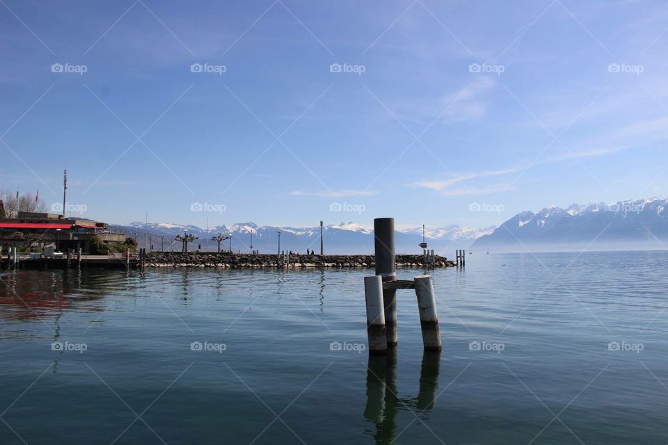 View of Lake Geneva . Photo of Lake Geneva taken in Lausanne from Ouchy overlooking Swiss Alps