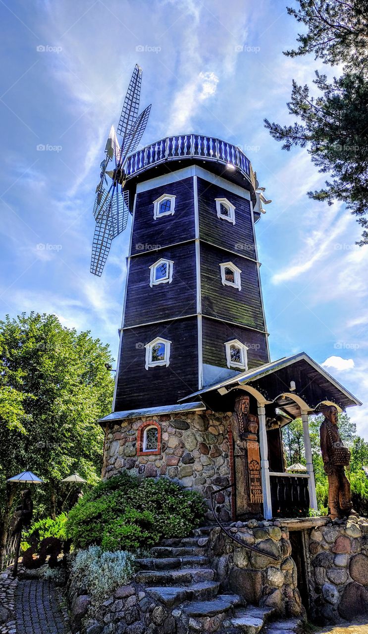 Mill in the wooden sculpture town. (Lithuania, Druskininkai, July, 2019).
