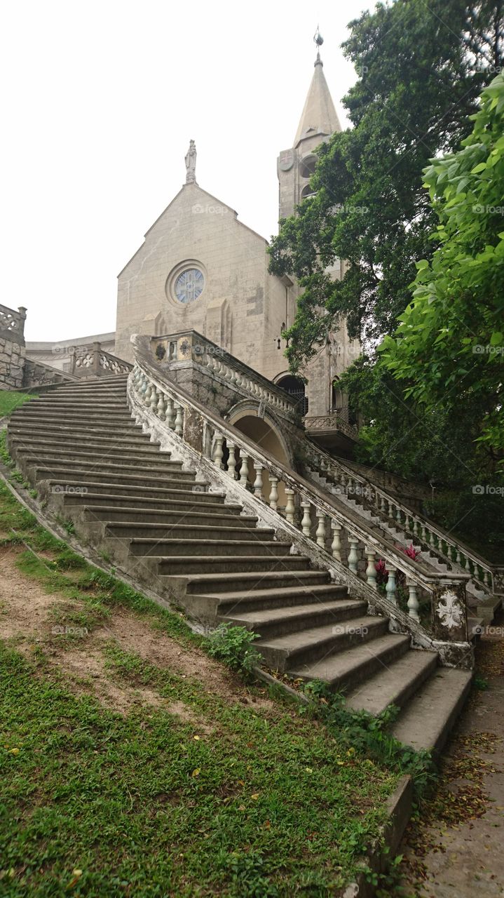 during my strolling on 19 march 2016, a foggy morning. the Chapel of our Lady of Penha with a spiral stairway is visible.  this church id located at the top of Penha hill.  the. place was donated by the Senado to the Agustinians. this church was built on. 1622.  if you are in this place, tbe Namvan is ovwr looking, ang Macau tower.