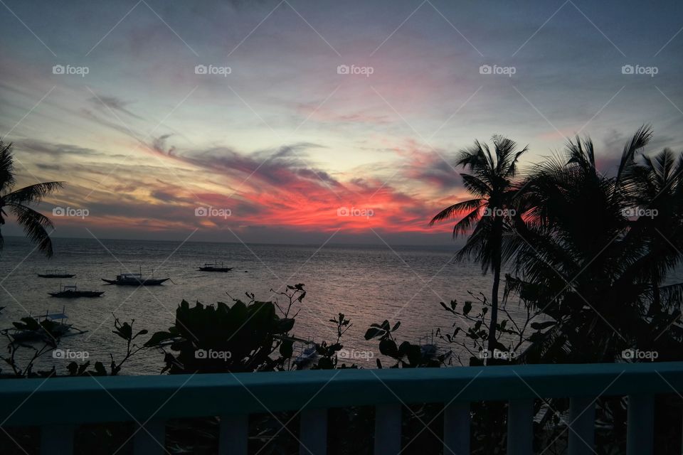 Scenic view of sea against sky during sunset 