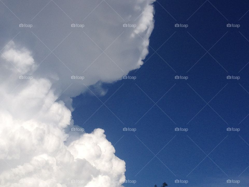 big fluffy white clouds in a bright blue sky