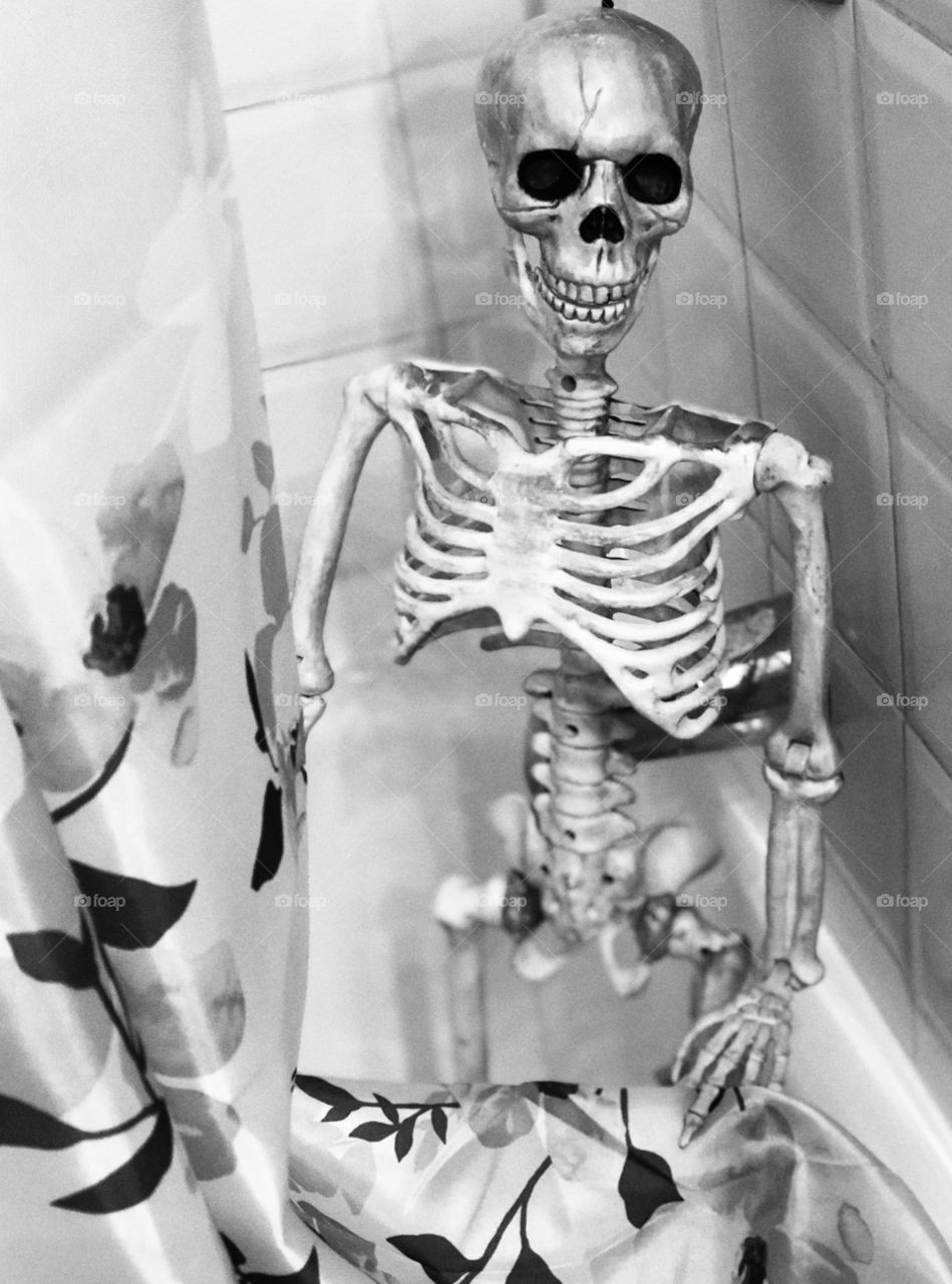 Black and white skeleton in the shower