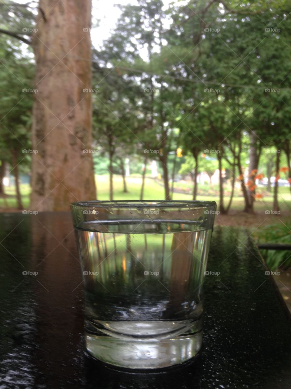 Cup on a table in the rain