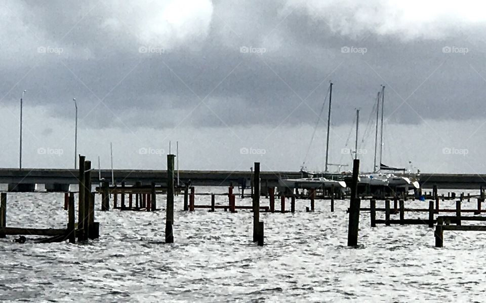 Broken piers with sailboats
