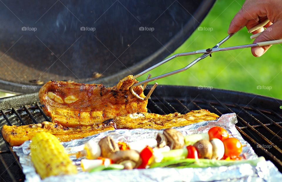 Human hand preparing a food