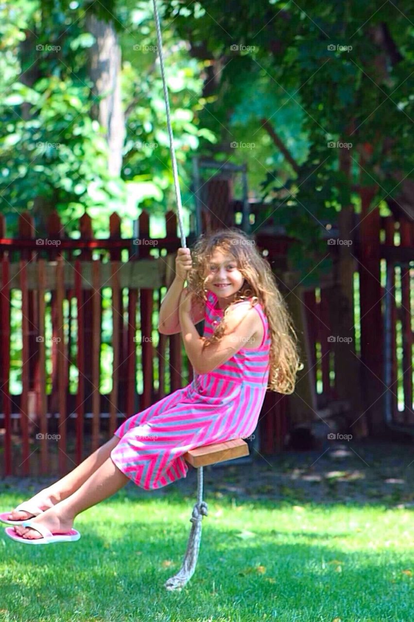 Little lady on a rope swing