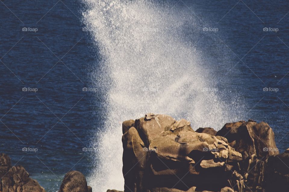 waves crashing on rocks
