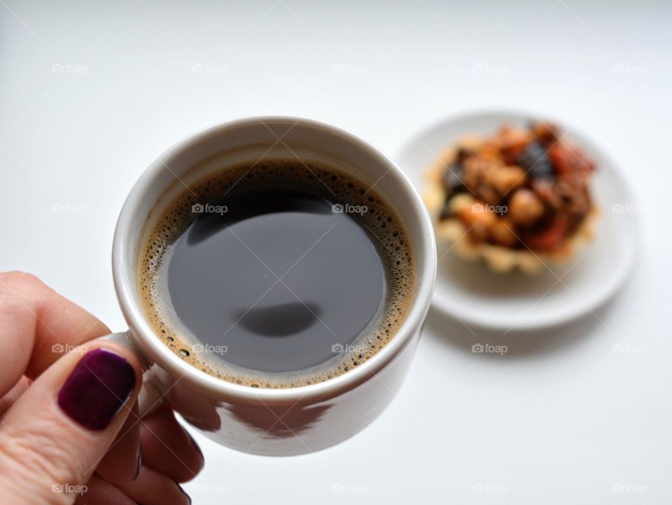 cup of coffee in the female hand